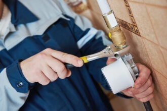 a man repairing gas line