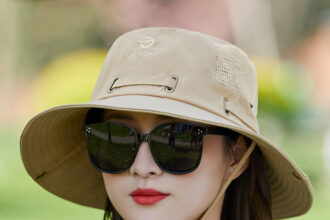 a fishinng hat and a sunglass worn by a young girl