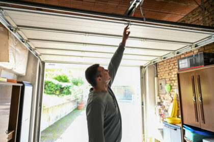 Man repair garage door.