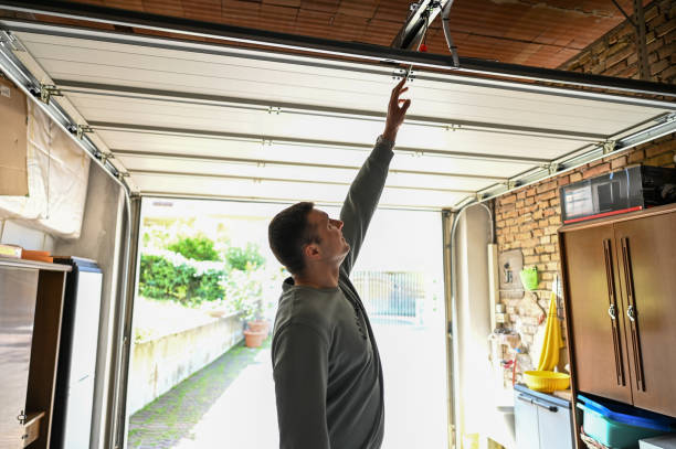 Man repair garage door.